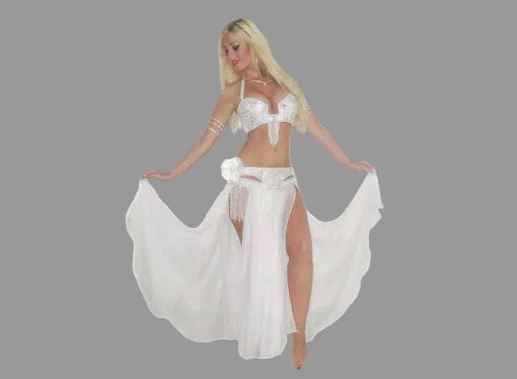 Woman in a white costume with a long flowing skirt on a black background