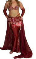 A woman modeling a professional red belly dance costume with a bra, skirt, and decorations.