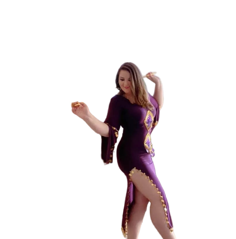 Woman wearing a purple dress with gold accents on a white background