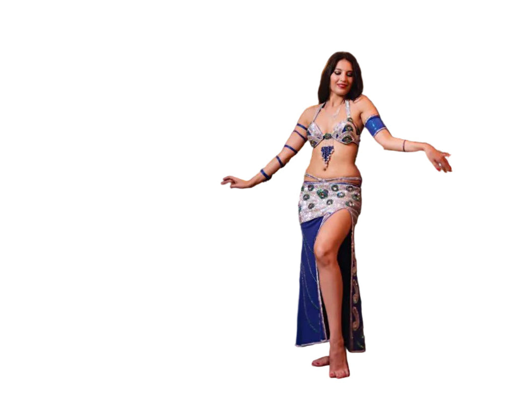 Woman wearing a colorful belly dance costume on a white background