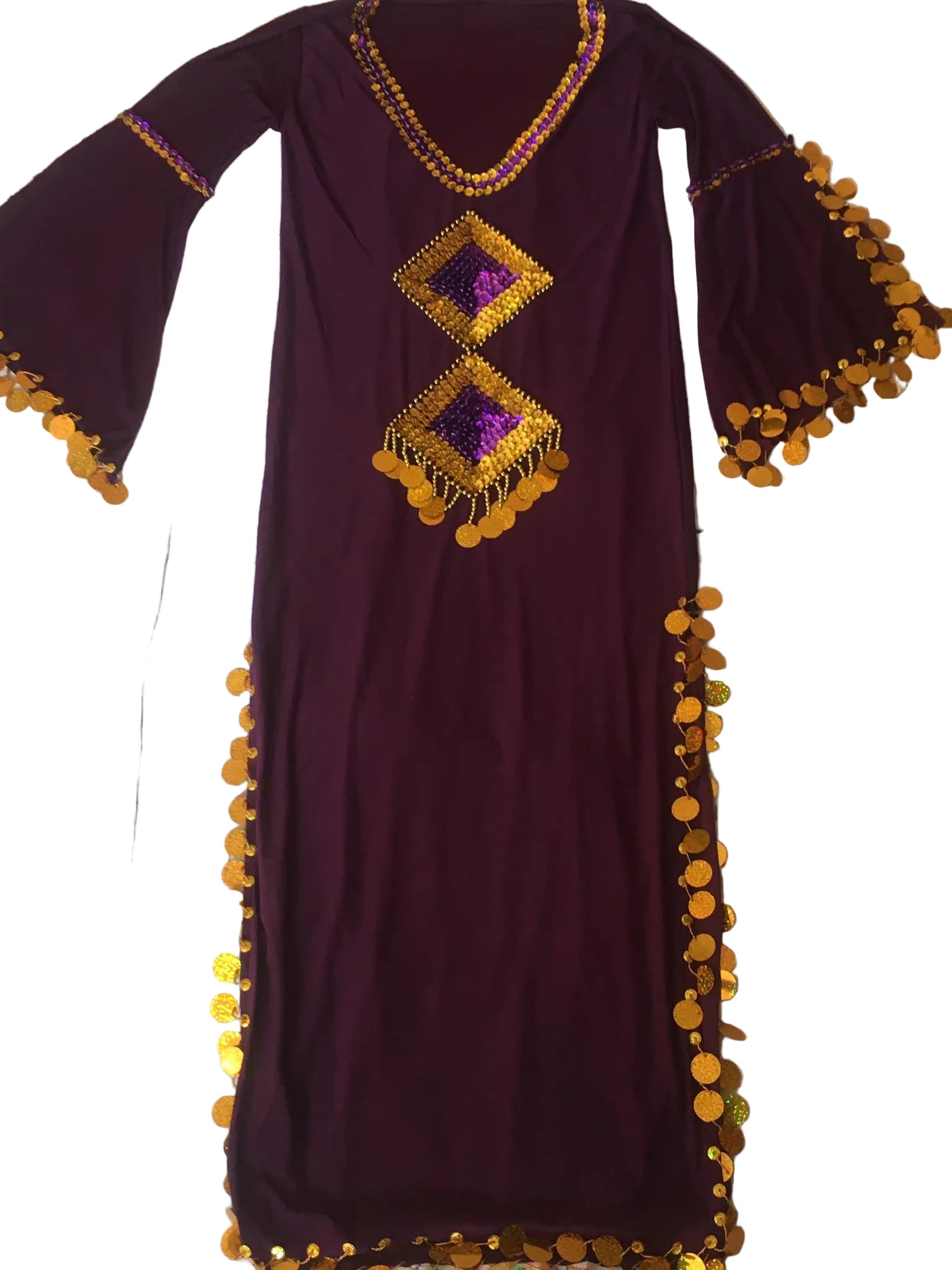 Purple dress with gold embellishments on a patterned fabric background
