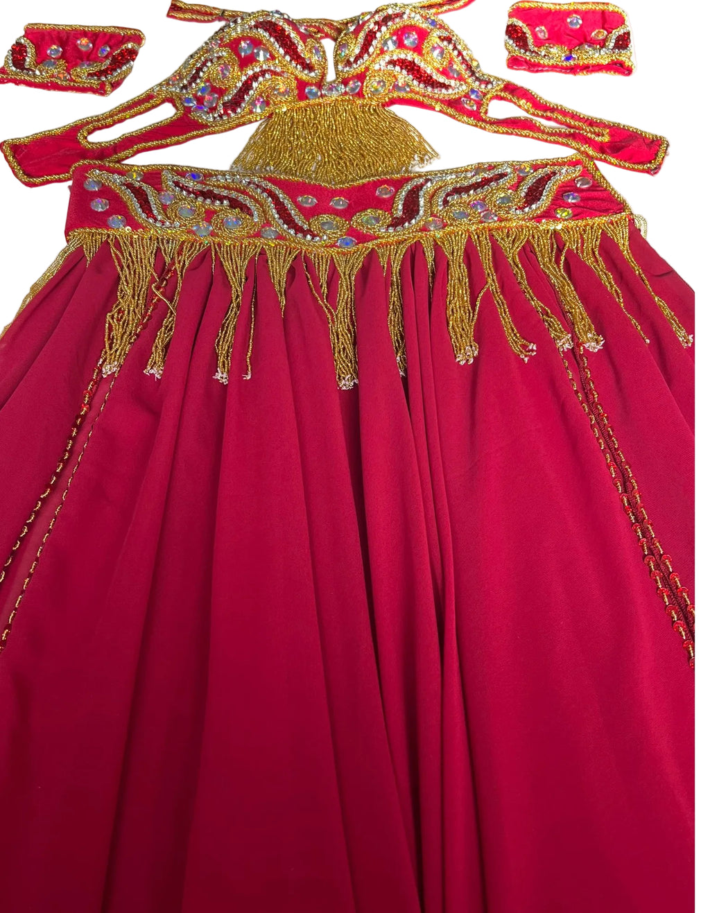 A professional belly dance costume set in wine red, including a skirt, belt, and bra, adorned with gold and multicolored beads, sequins, and rhinestones.