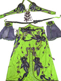 A neon yellow belly dance costume set laid flat on a white fabric background, featuring a beaded top with dangling beads, a matching belt, purple sheer sleeves, and a long skirt with purple and silver beadwork.