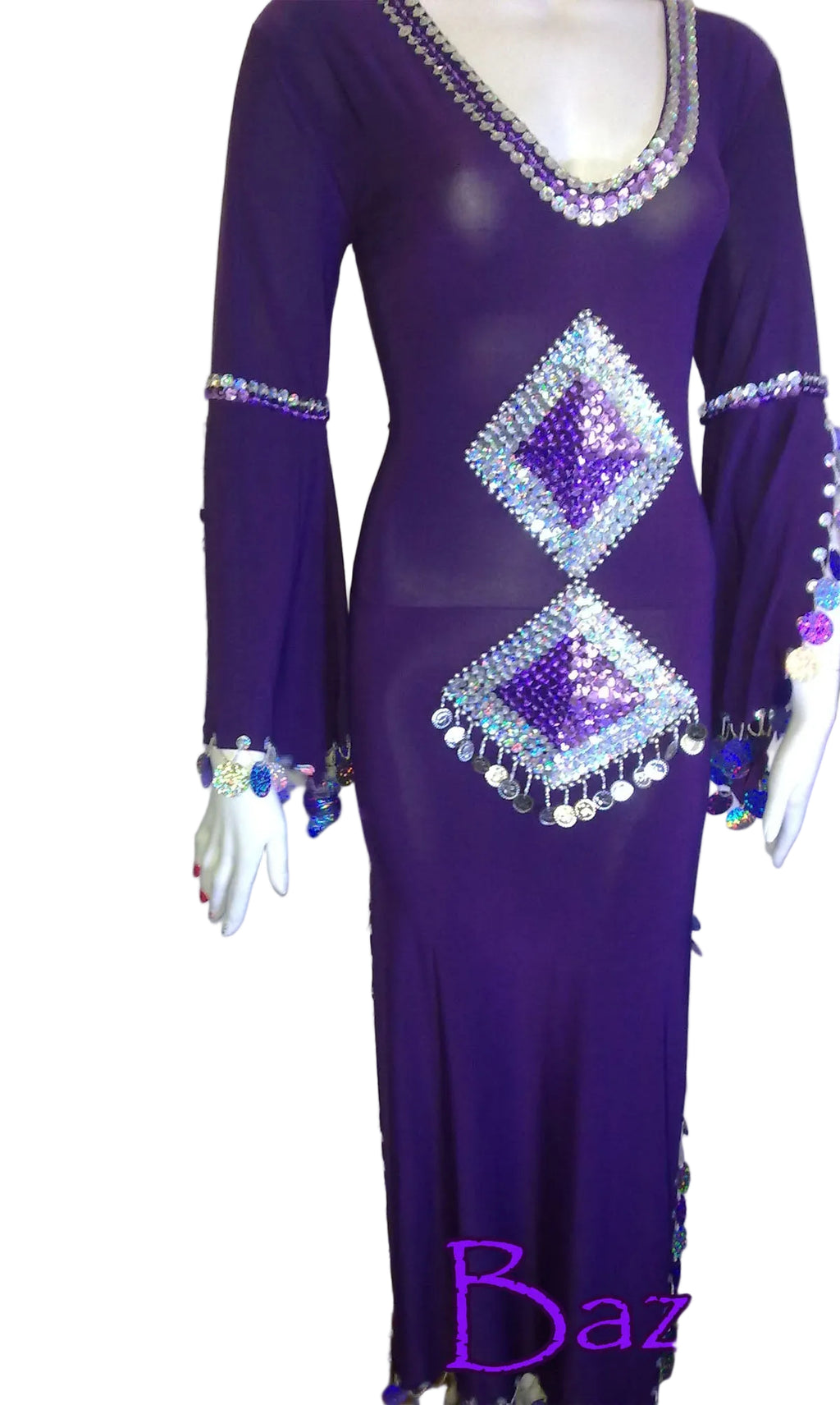 Purple belly dance dress with diamond patterns and beading on a mannequin, branded 'Luxor Bazar'.
