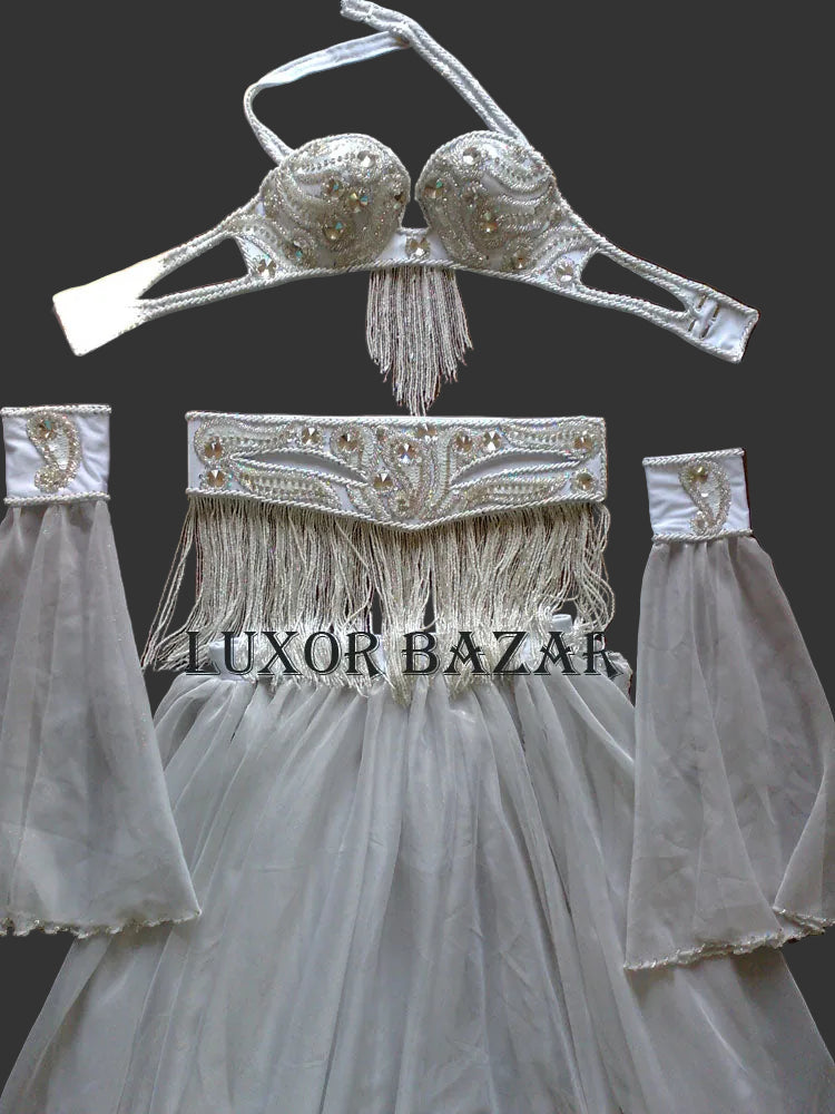 Decorative headpiece with fringe and embellishments on a dark background, branded 'Luxor Bazaar'.