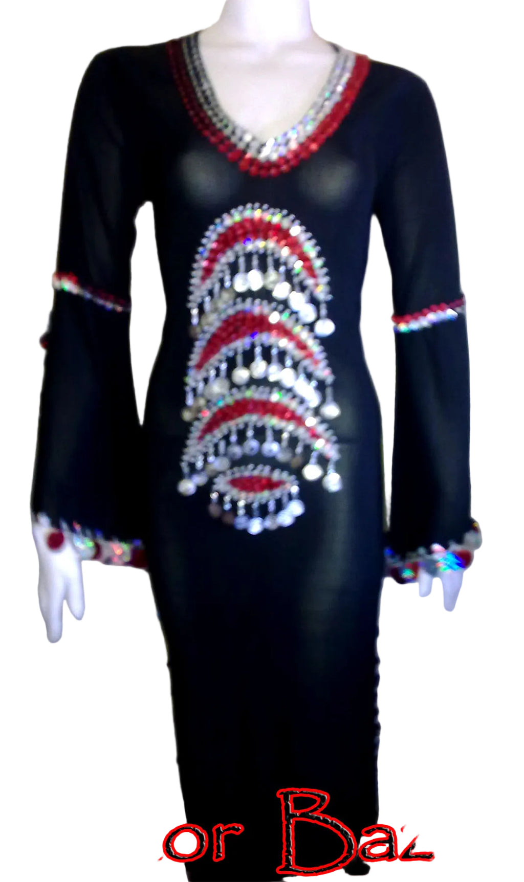 Black dress with red and silver embellishments on a mannequin against a plain background.