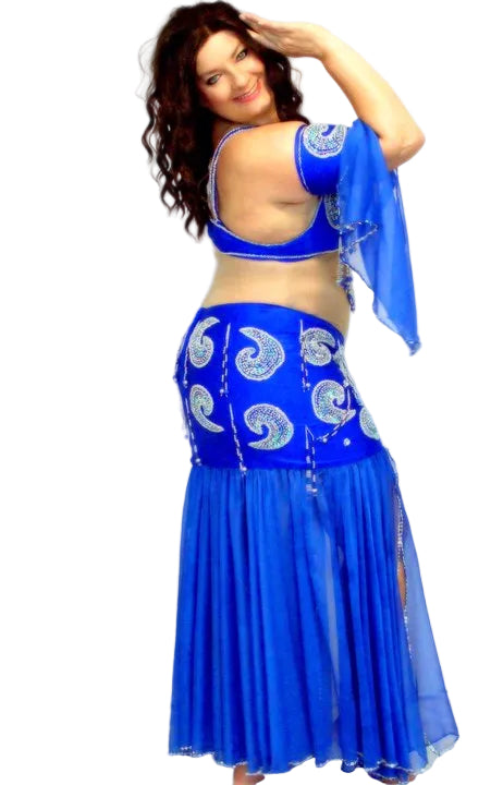Woman wearing a blue traditional outfit with intricate designs on a white background