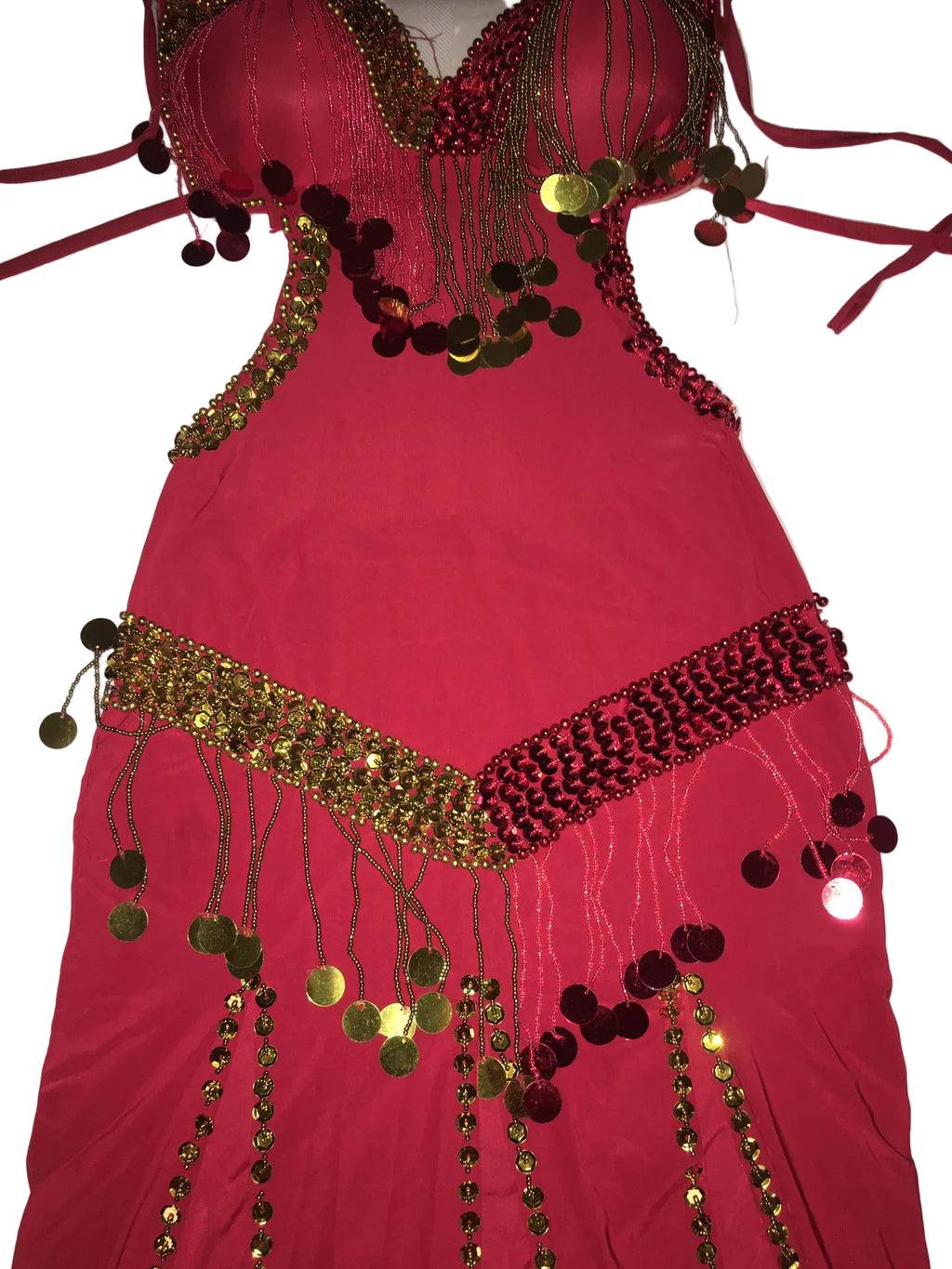 Red dress with gold and black embellishments on a white background