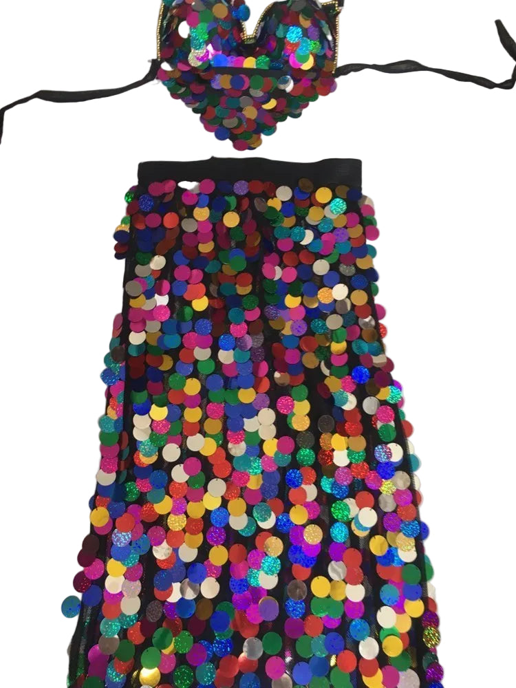 Colorful sequin dress with a matching headpiece on a white background