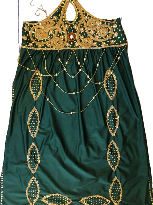Green fabric with gold embroidery on a floral background