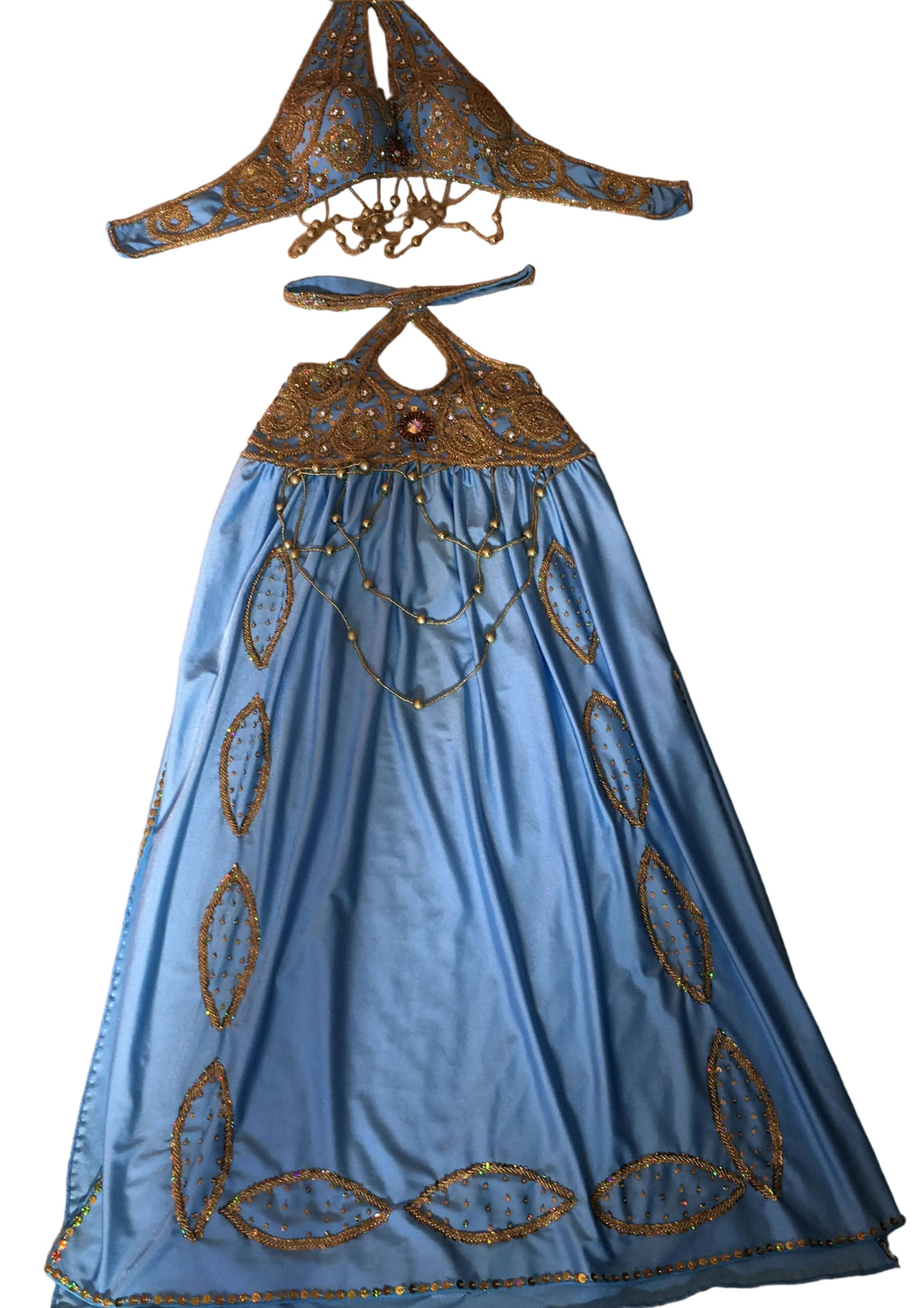 Blue dress with gold embroidery on a beige background