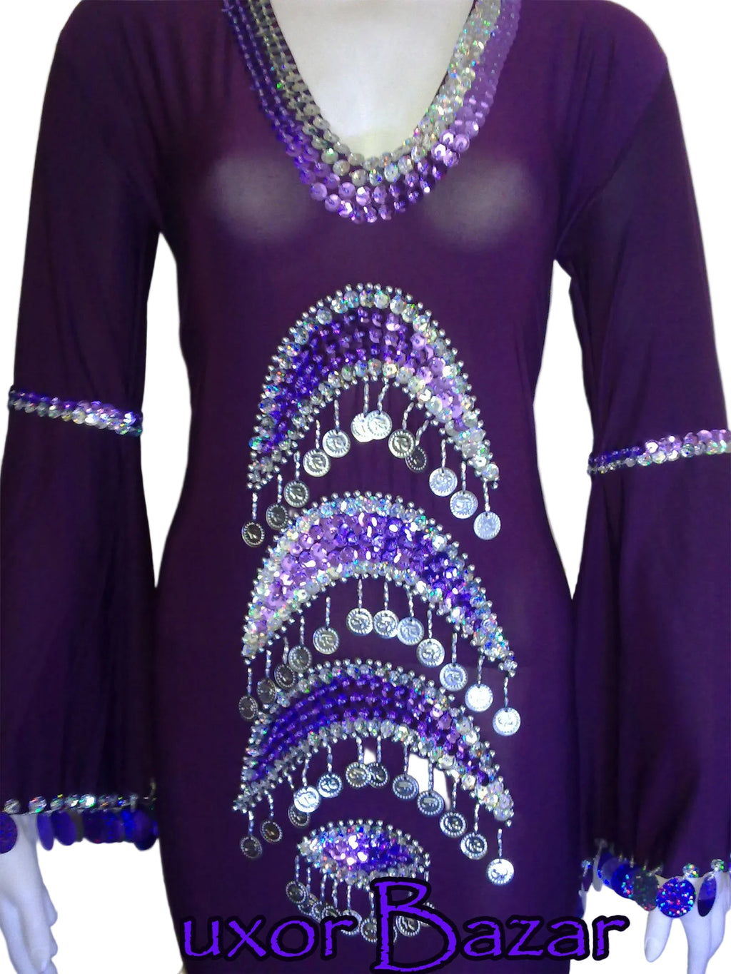 A red belly dance costume featuring handcrafted embroidery in a pattern, with embellishments in the form of coins and decorative elements.