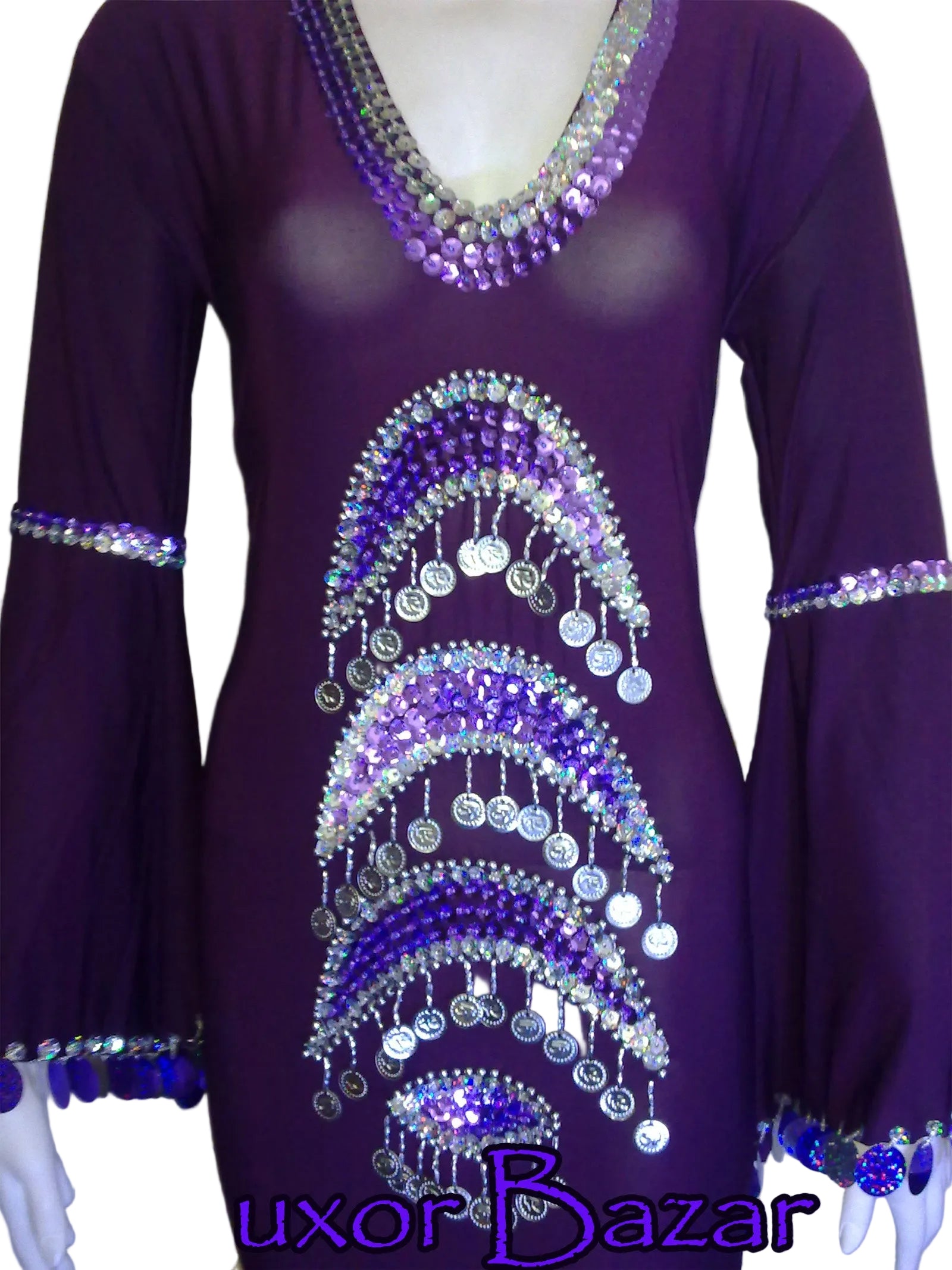 A red belly dance costume featuring handcrafted embroidery in a pattern, with embellishments in the form of coins and decorative elements.