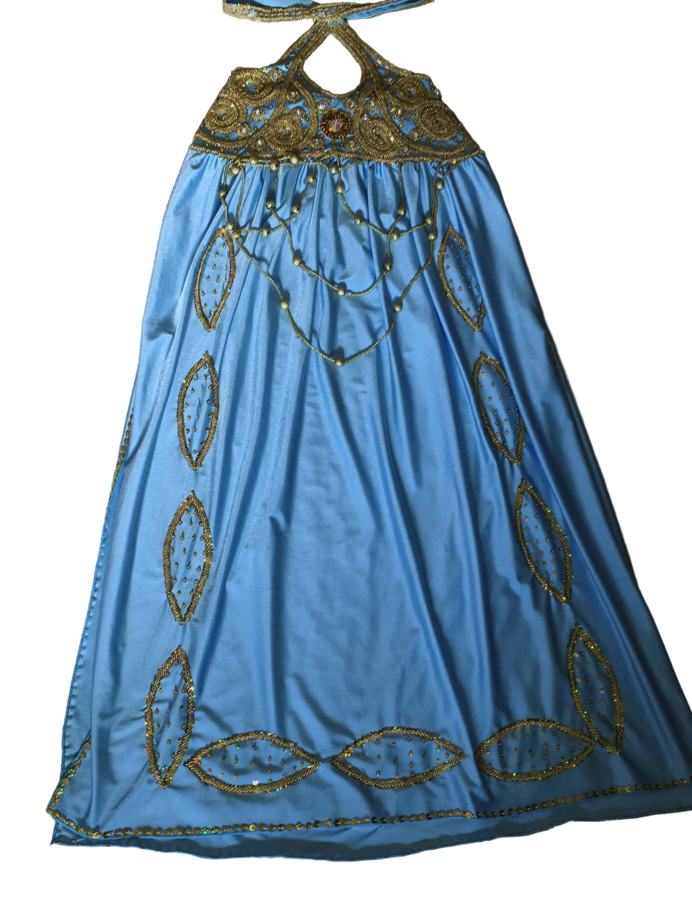 Blue dress with gold embroidery on a beige surface