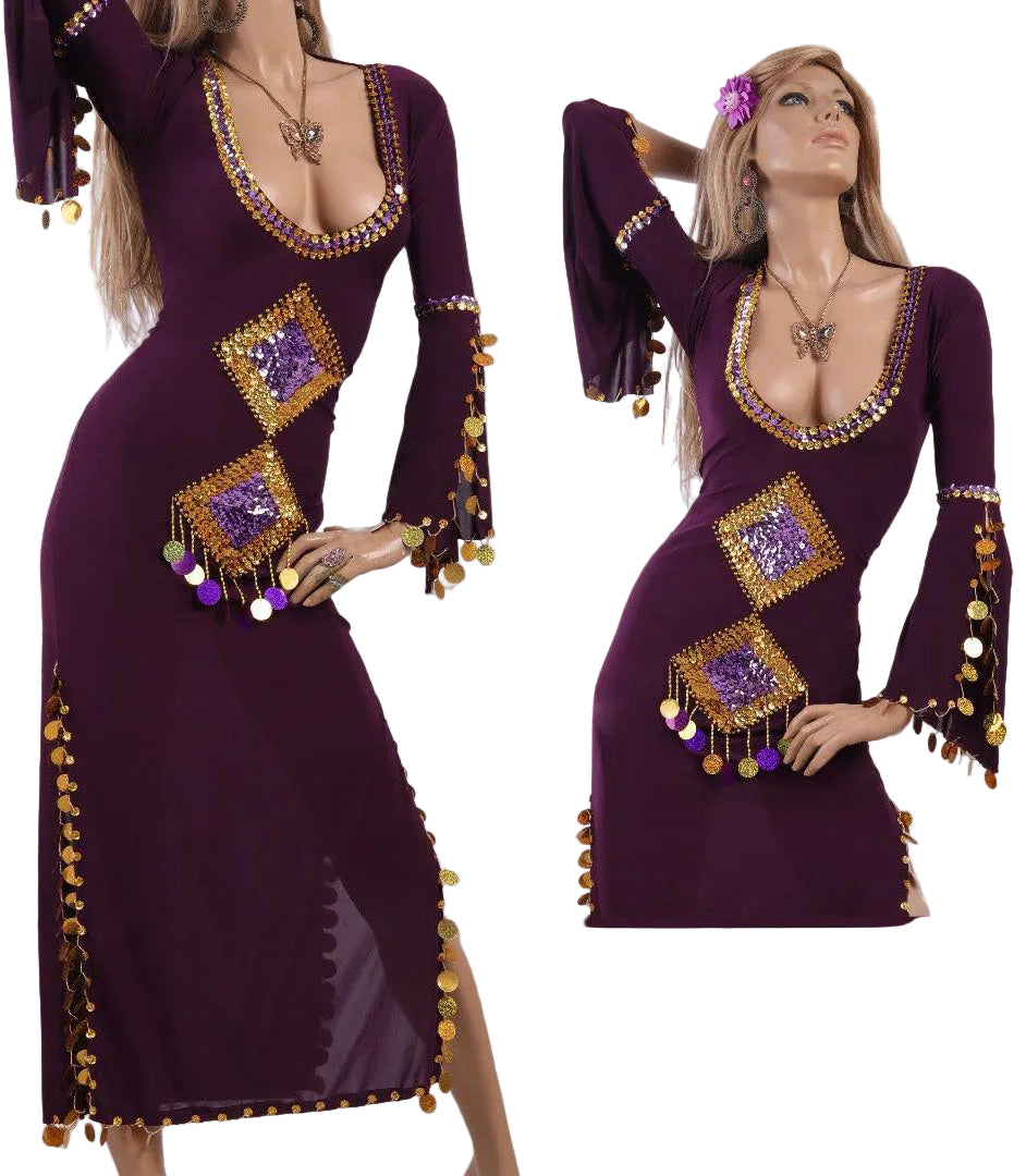 A model wearing a purple belly dance dress with embroidered details and a belt, posing in a room with Egyptian-themed decorations.