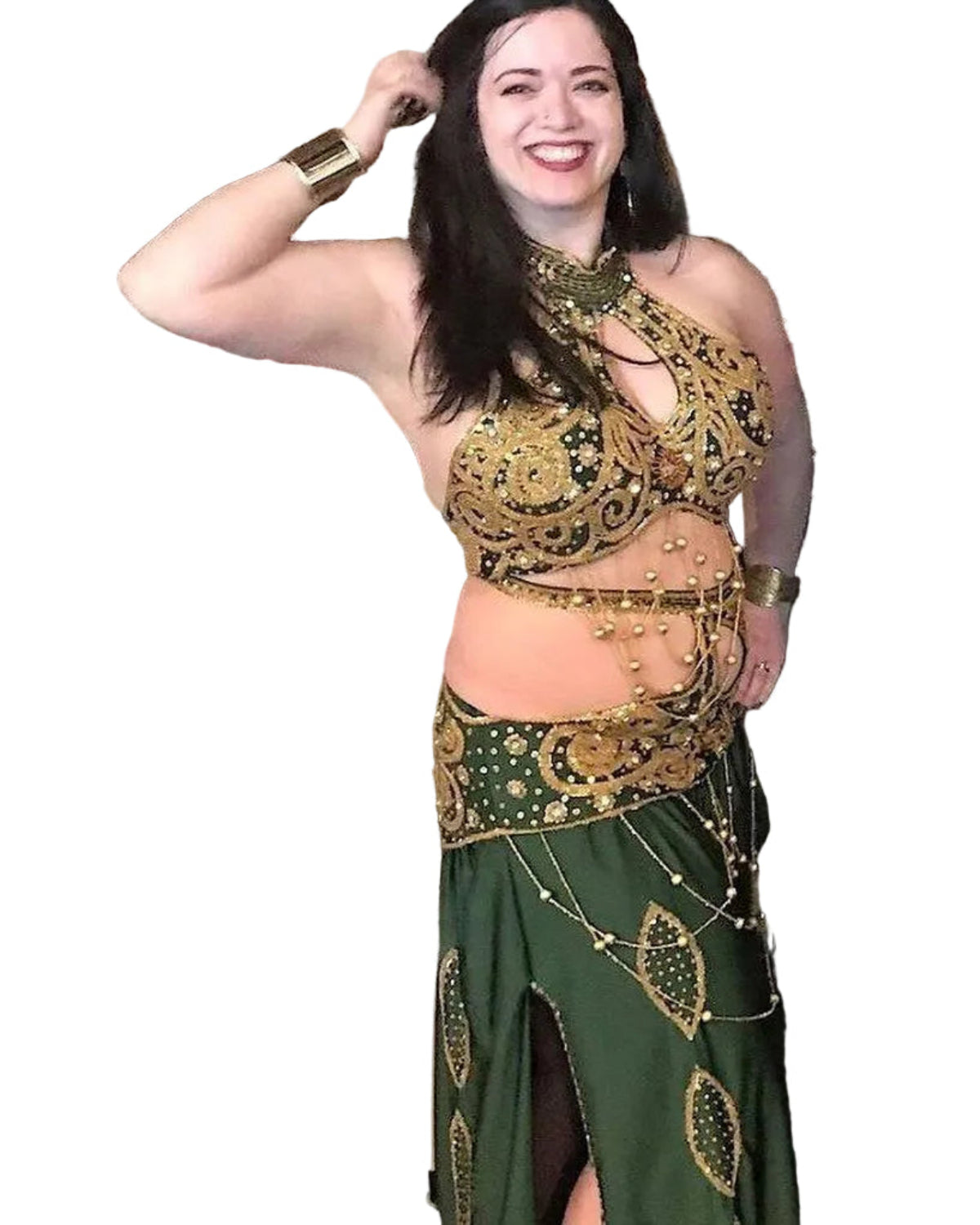 A woman wearing a green and gold belly dance costume with intricate embroidery and sequins, posing with a dance pose.