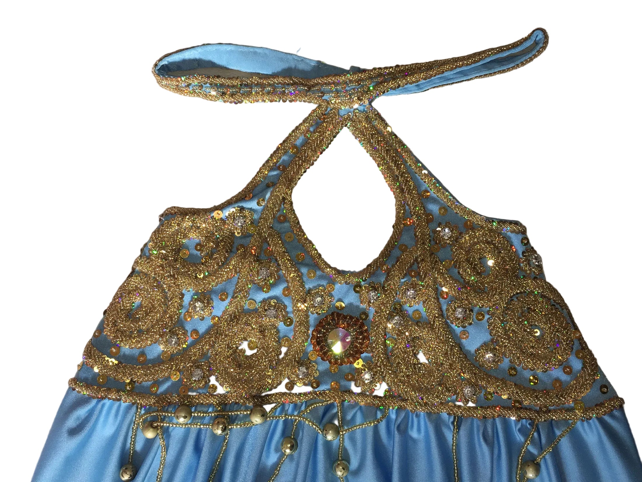 Blue and gold embroidered top on a beige textured background