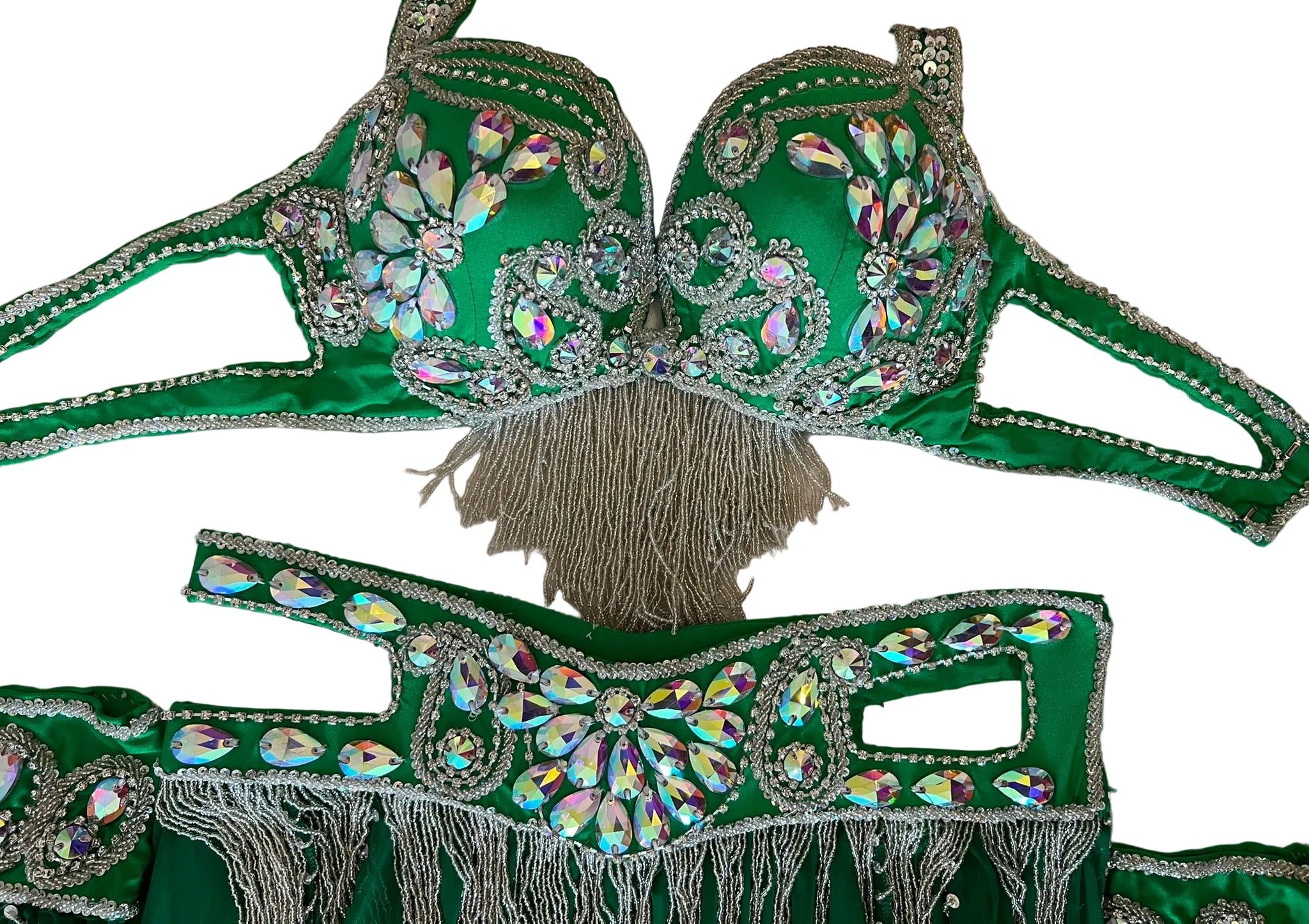 Green bra and panties set with rhinestone embellishments on a beige surface