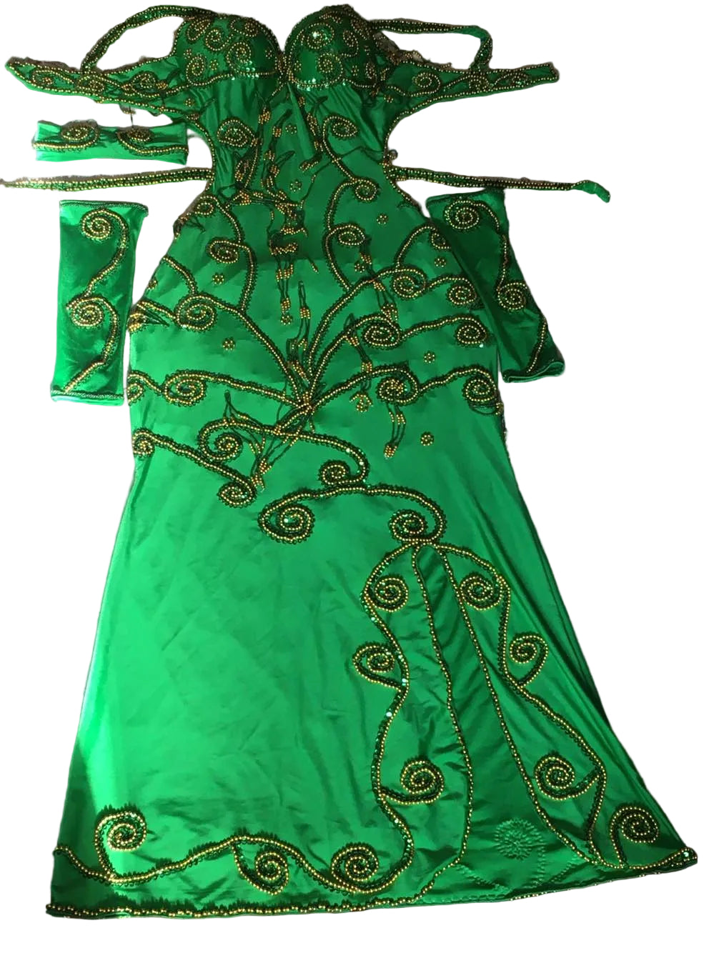 A green belly dance costume with embroidered details, including a dress, sleeves, and a headband, displayed on a flat surface.