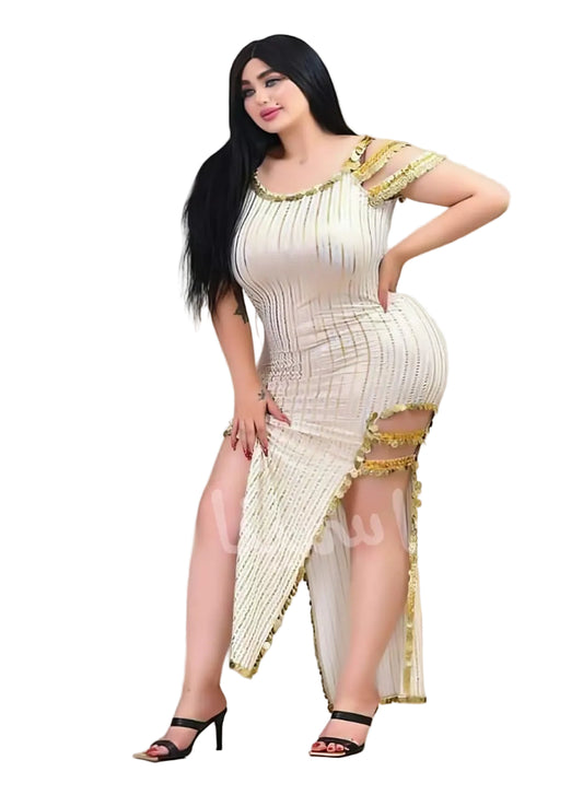 Woman wearing a cream-colored dress with gold trim on a white background