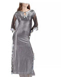 A long black Saidi belly dance dress with silver stripes and handmade embellishments, displayed on a mannequin.
