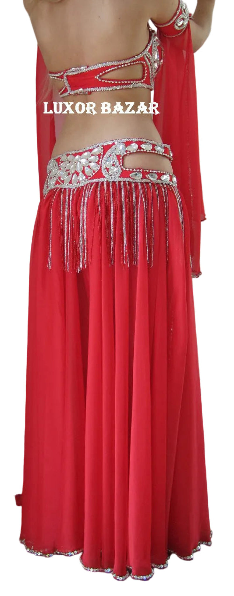 Red belly dance costume with intricate designs and 'Luxor Bazar' branding.
