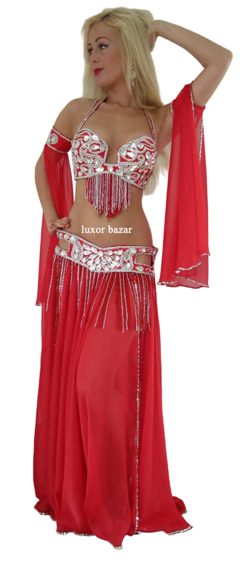Red and white belly dance costume with fringes on a plain background