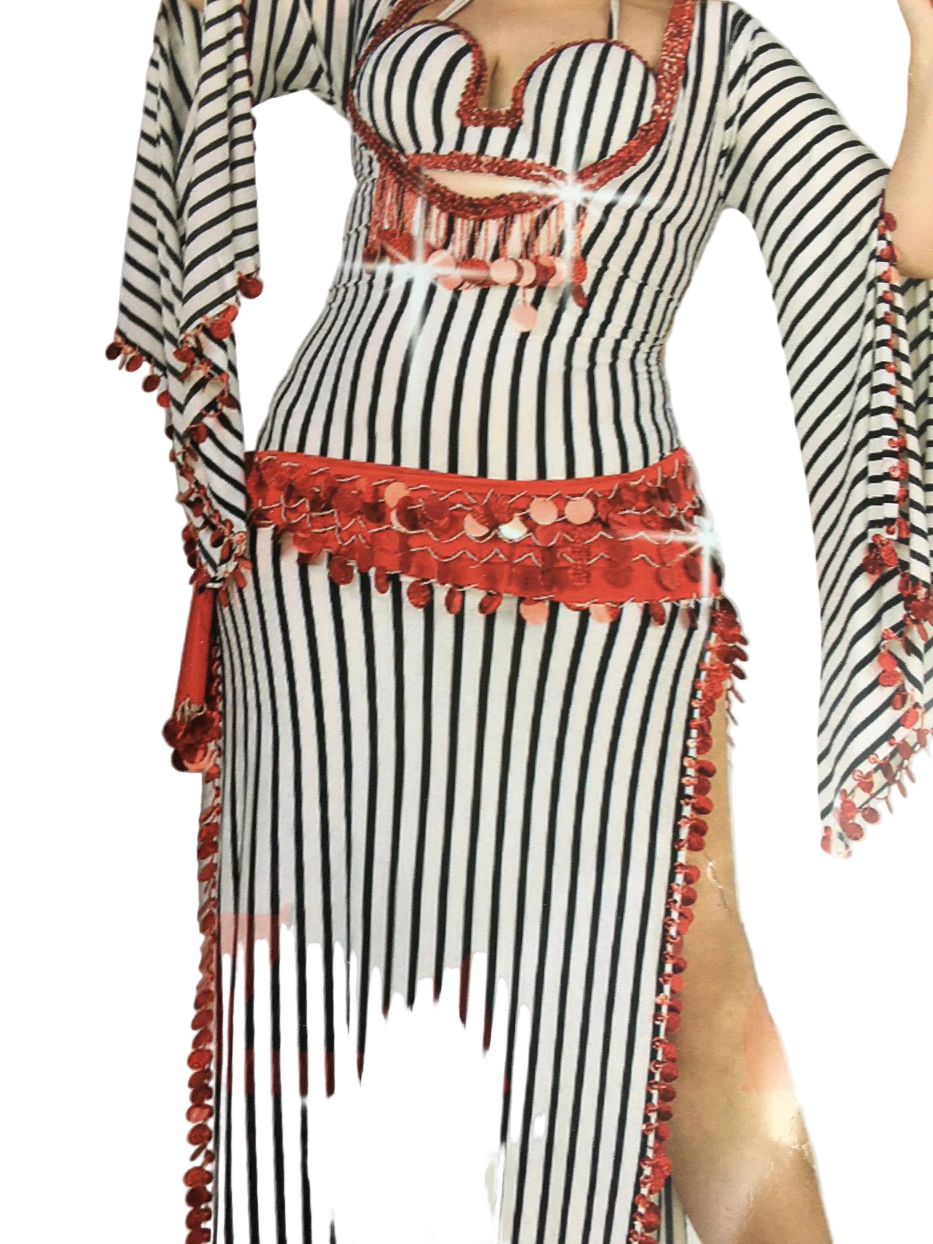 A model wearing a black and white striped belly dance dress with red accents and a matching headpiece.