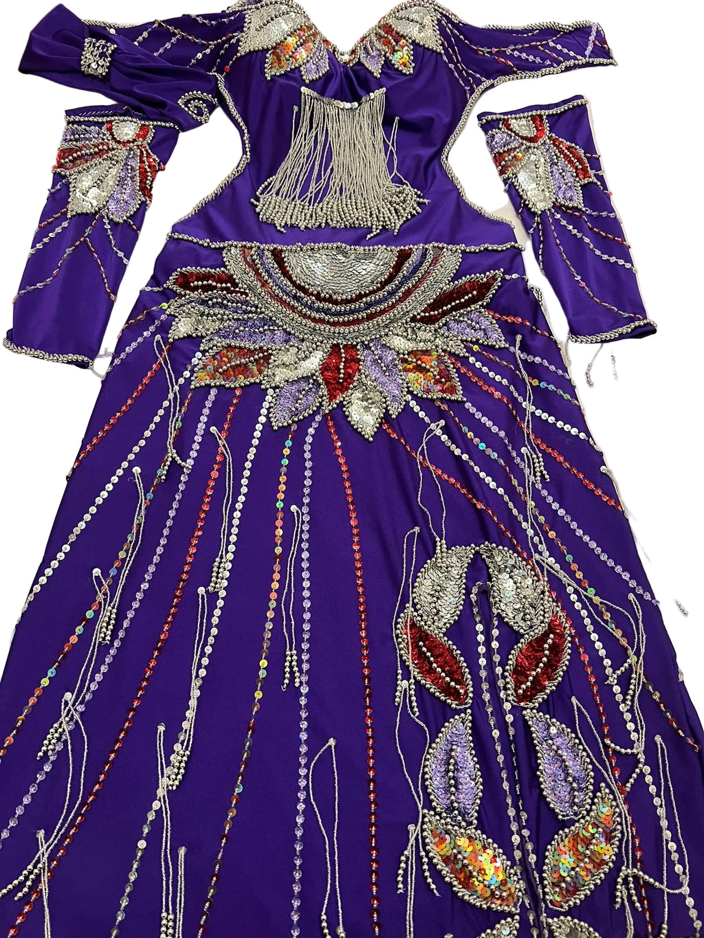 Purple beaded outfit on a white surface