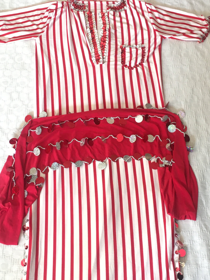 An Egyptian belly dance dress with red and white stripes, including a small matching hip scarf.