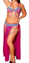 Woman wearing a colorful belly dancing costume with a purple skirt and beaded top.