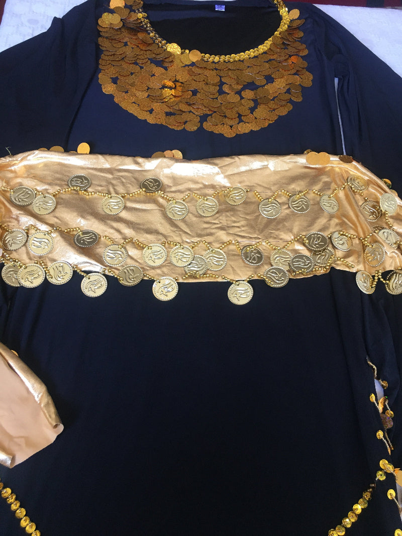Black belly dance dress embellished with golden accents and matching hip scarf
