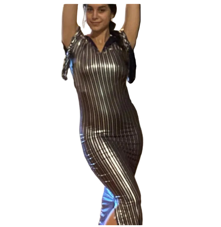 A person wearing a traditional Egyptian Saidi costume, featuring a black and blue striped pattern, commonly known as a Galabia, used for belly dance performances.
