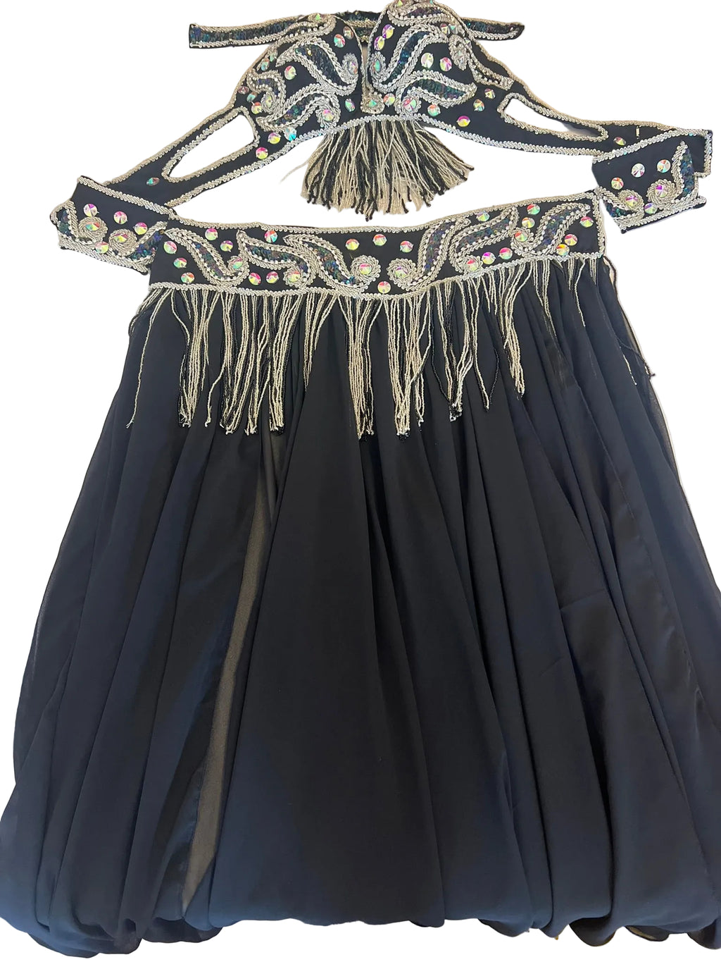 Black dress with intricate beaded belt on a white surface