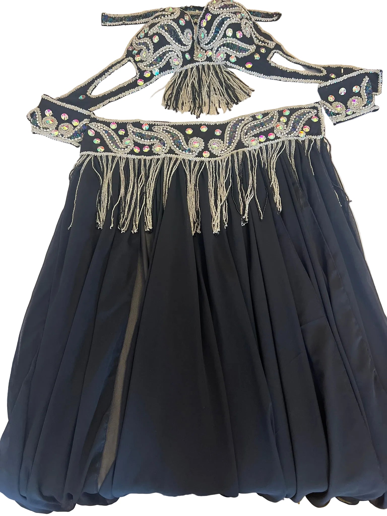 Black dress with intricate beaded belt on a white surface