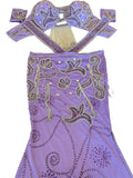 Purple embroidered belly dance outfit on a white surface