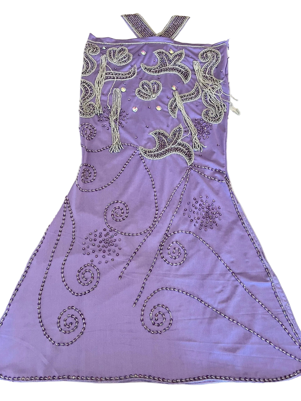 Purple dance dress with intricate silver beading on a white surface