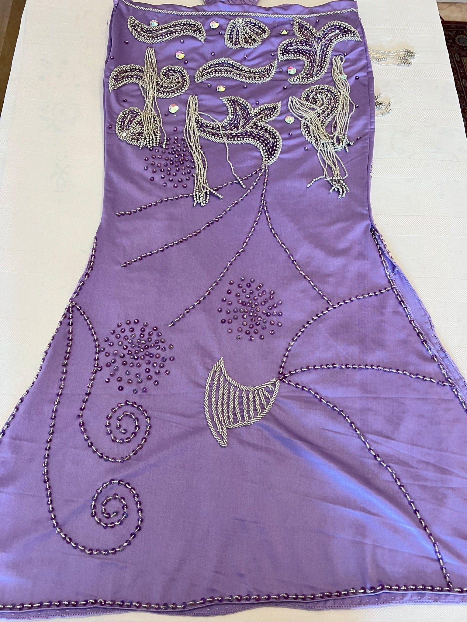 Purple belly dance skirt back side with silver embroidery on a white background
