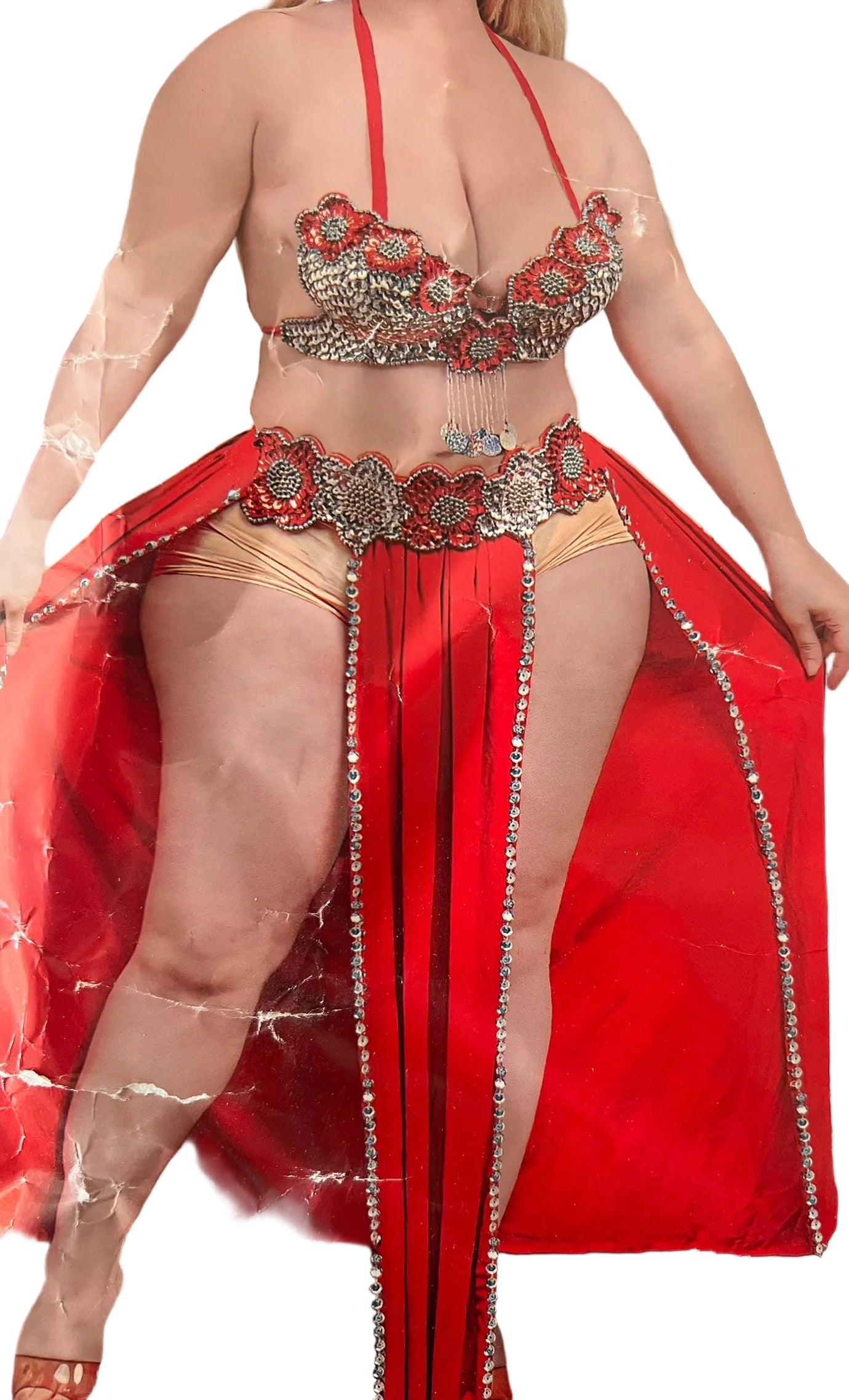 Person wearing a red and gold outfit with intricate designs.