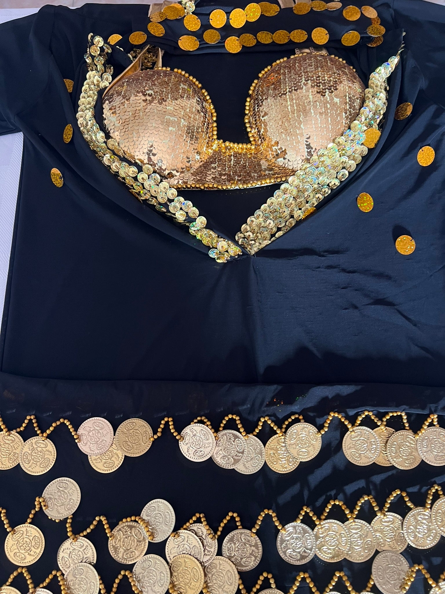 Navy blue fabric with gold sequin and bead embellishments