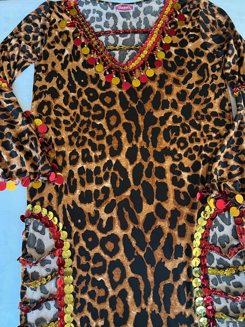 An Egyptian leopard print belly dance dress with side slits, designed in a Saidi Galabia style.