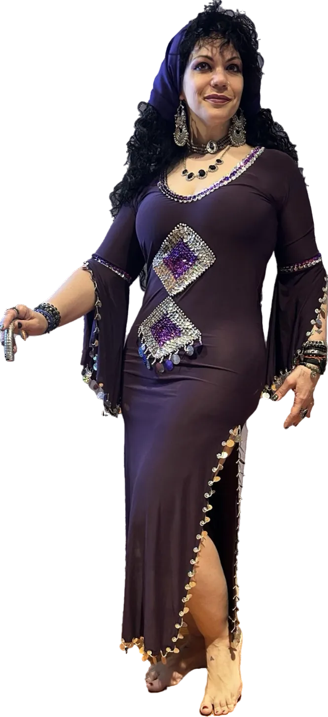 Woman wearing a purple dress with decorative elements on a white background