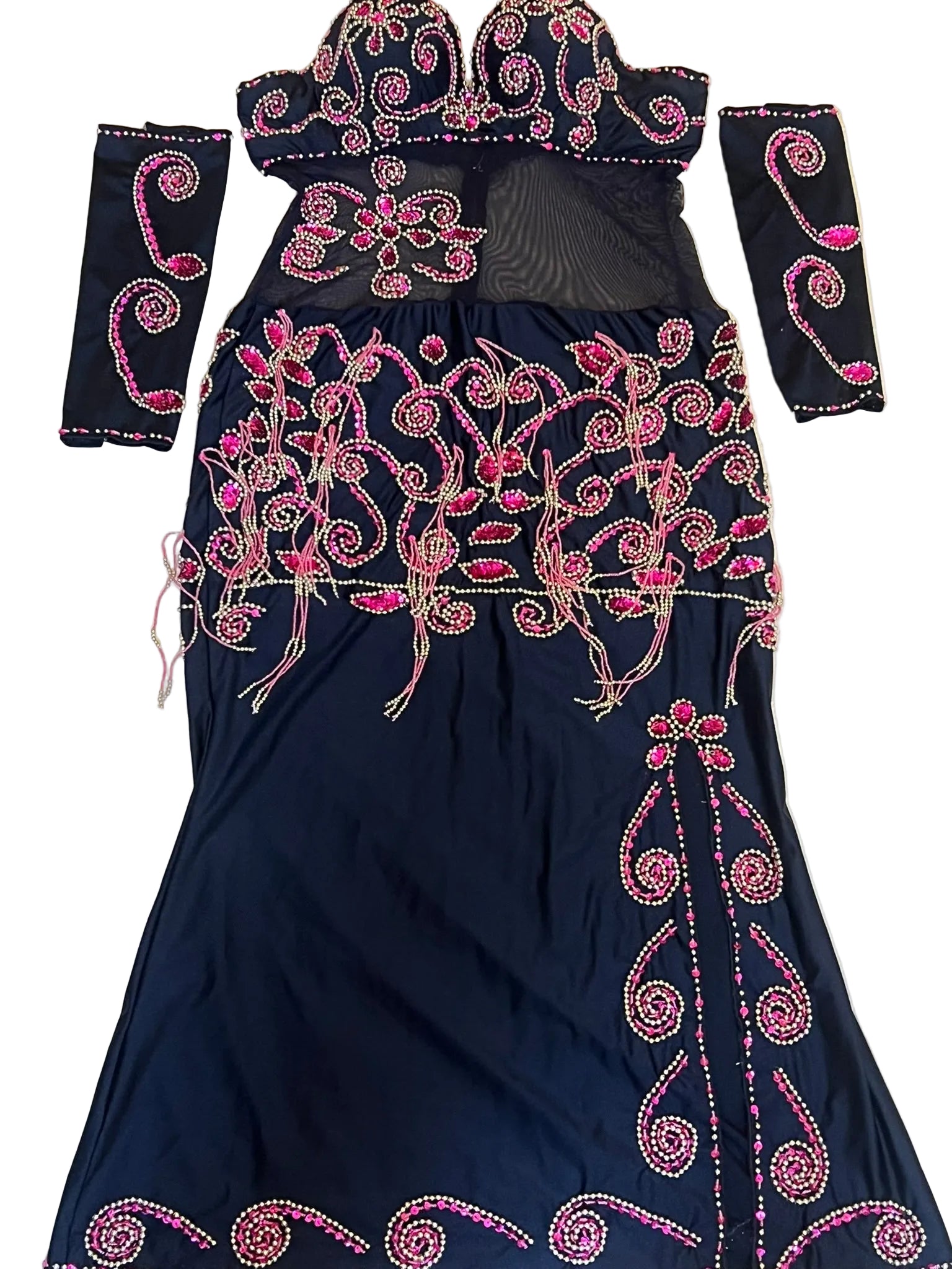 Black dress with pink embroidery on a beige background