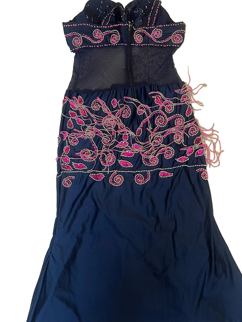 Navy blue garment with pink embroidery on a light background