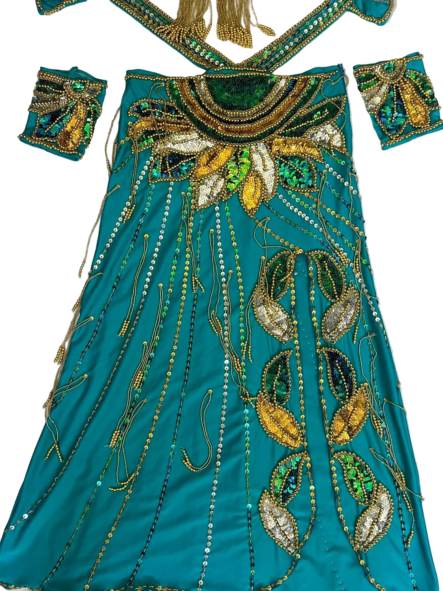 Teal embroidered outfit with gold and green details on a white background