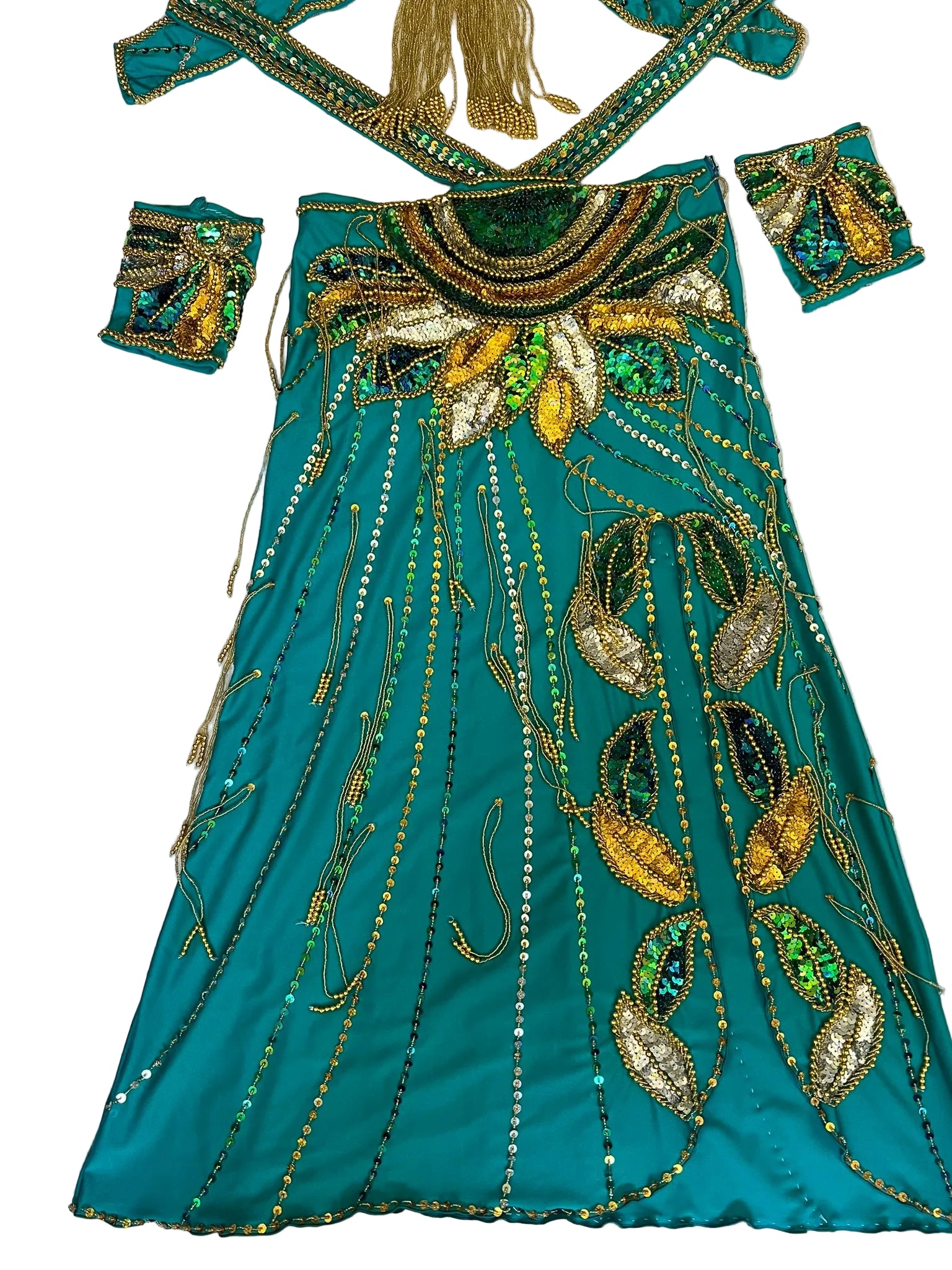 Teal embroidered outfit with gold and green details on a white background