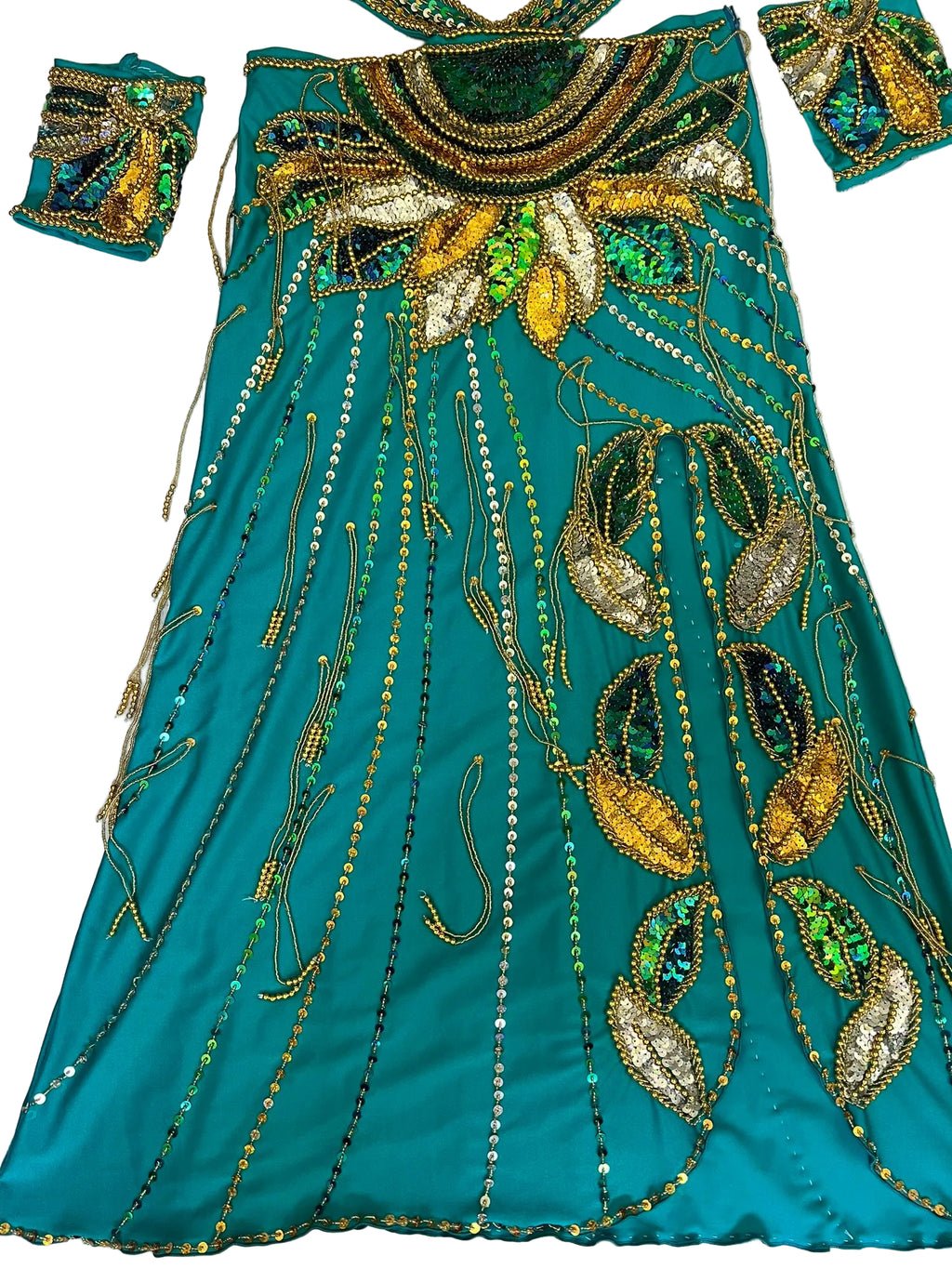 Teal fabric with gold and green embroidery on a white background