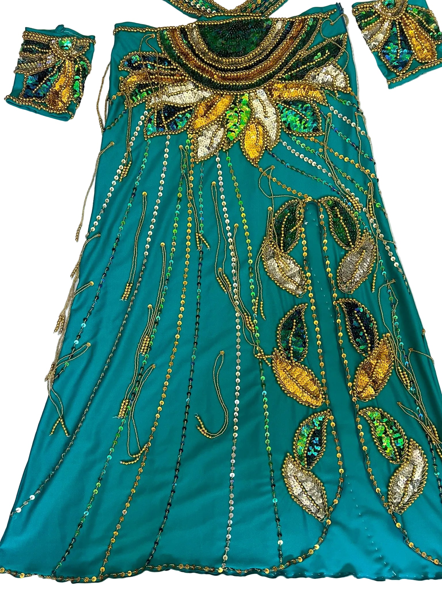 Teal fabric with gold and green embroidery on a white background