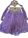 Purple costume with intricate beading on a white surface