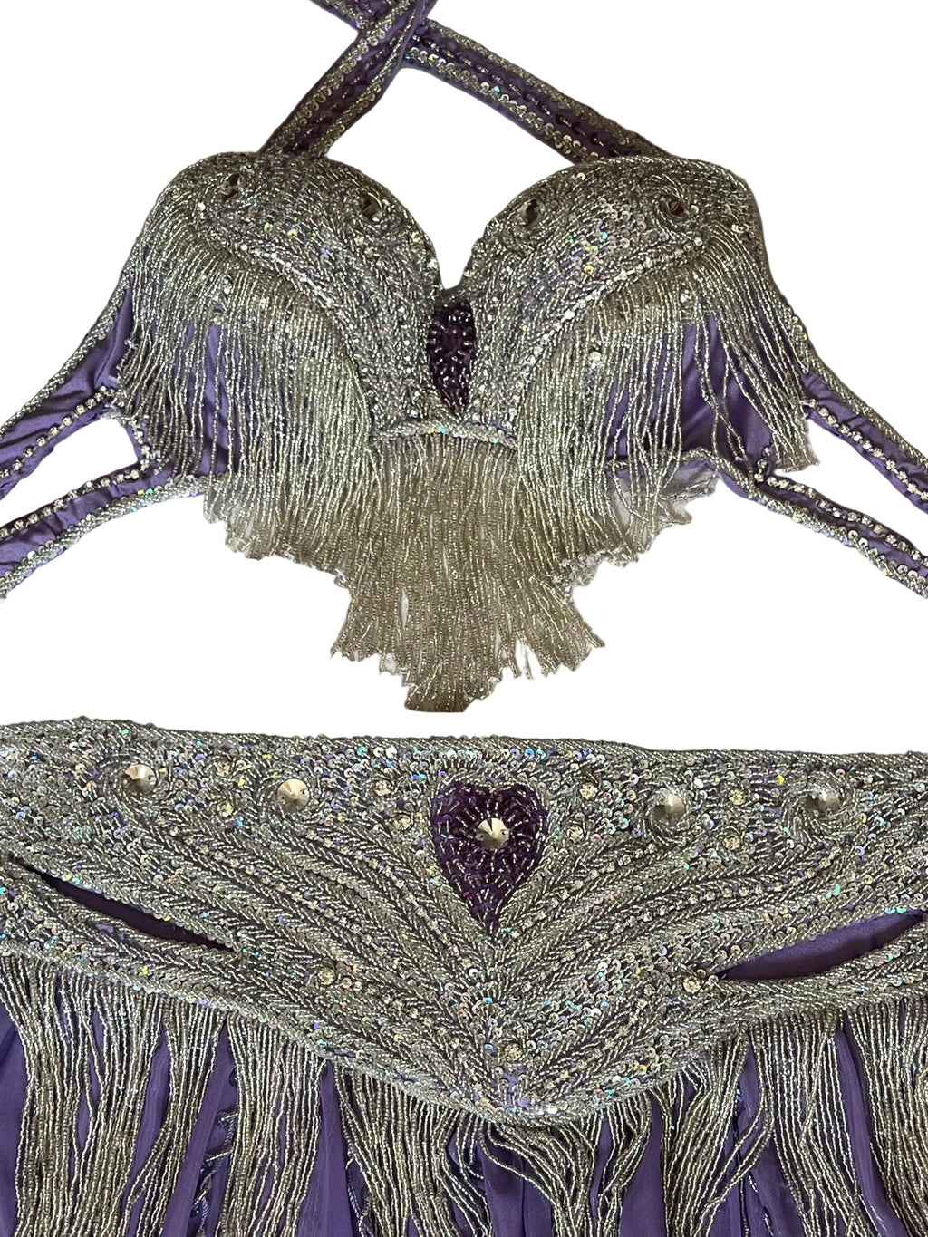 Decorative bra with fringe and beading on a textured surface